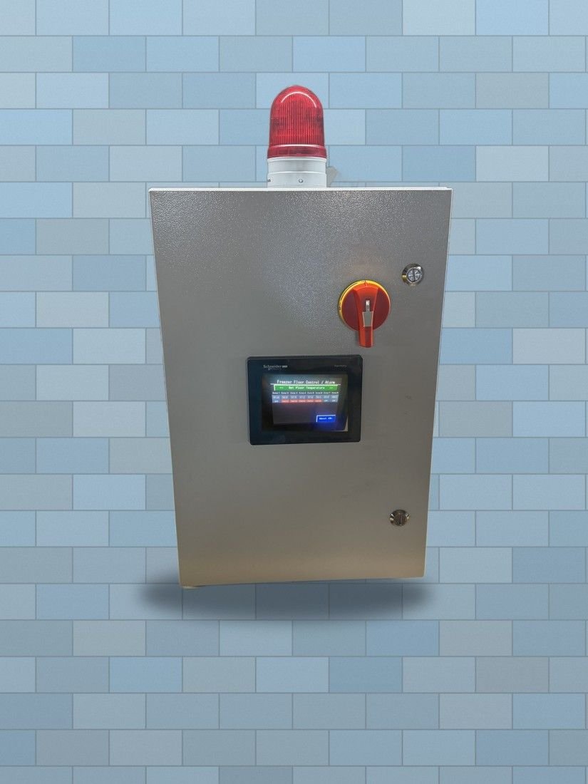Freezer floor control panel with red alarm beacon, main disconnect handle and touchscreen